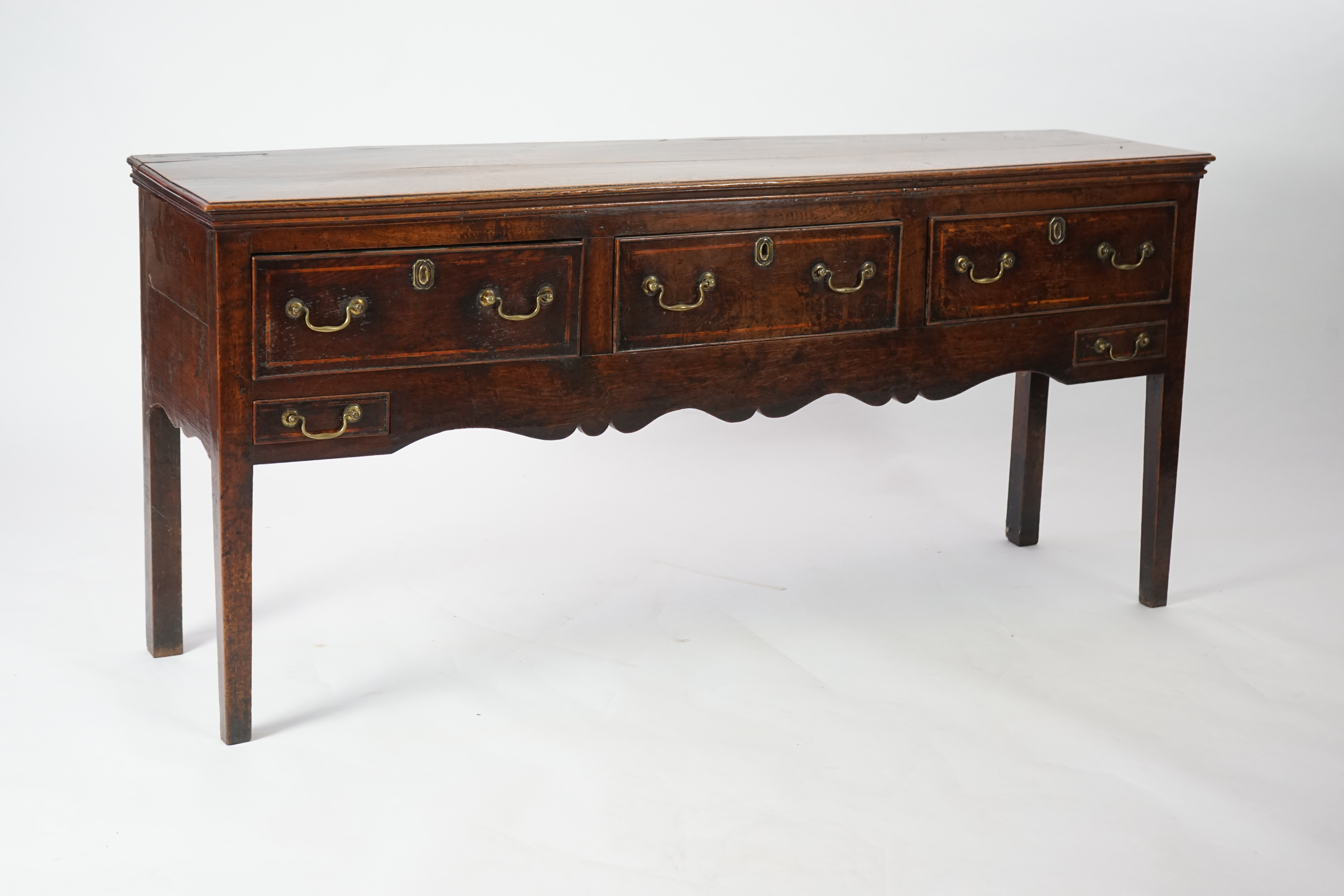 A mid 18th century oak dresser base